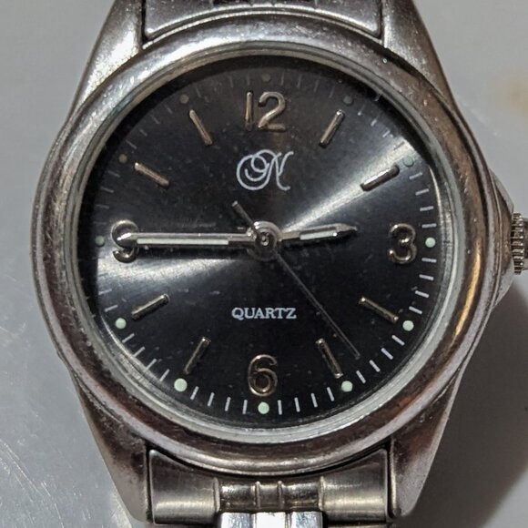 Simple stainless-steel quartz wristwatch with Japan movement and “N” logo dial. - Picture 1 of 3